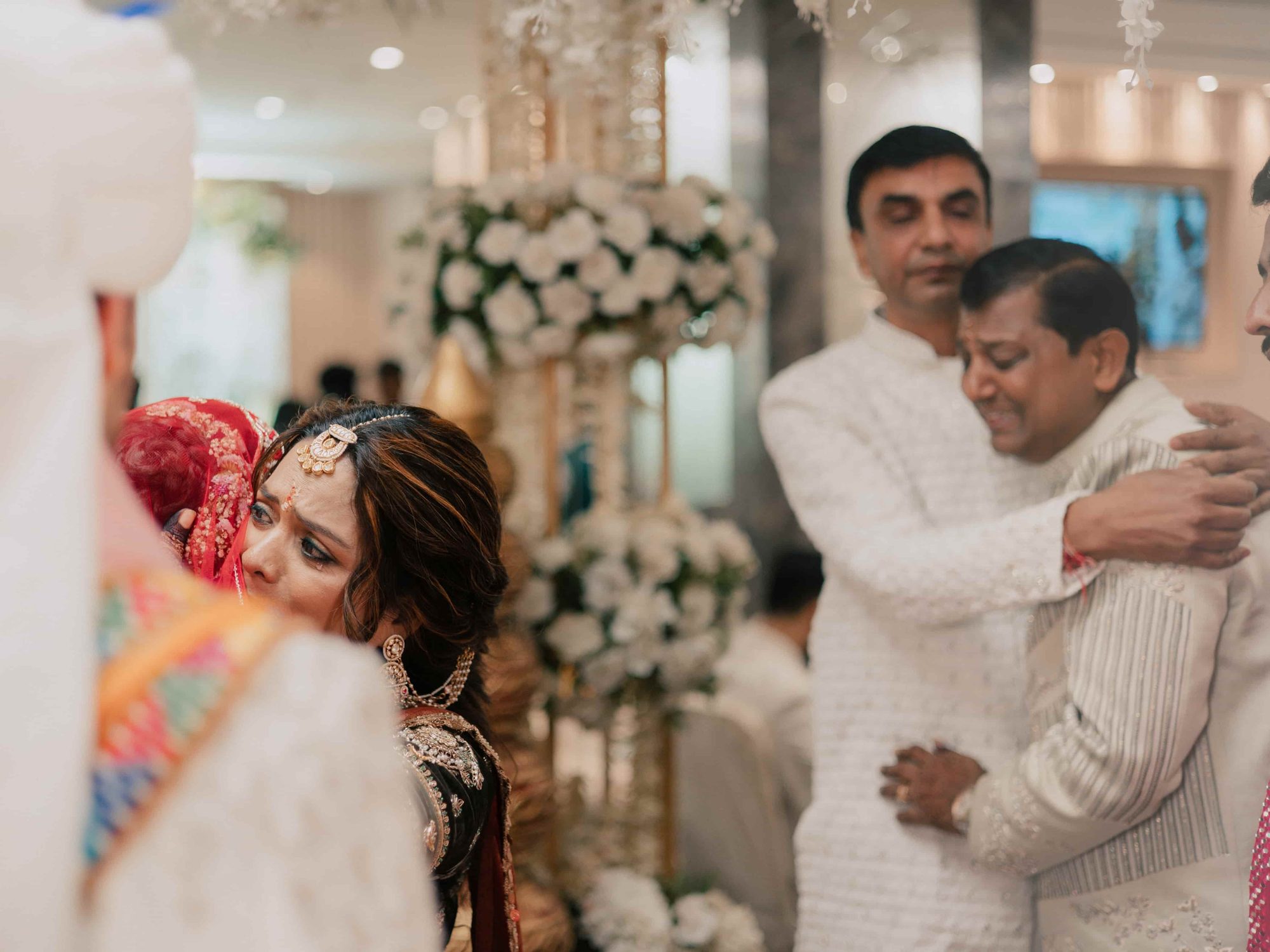 Vidaai - the bride embraces her father as she leaves home